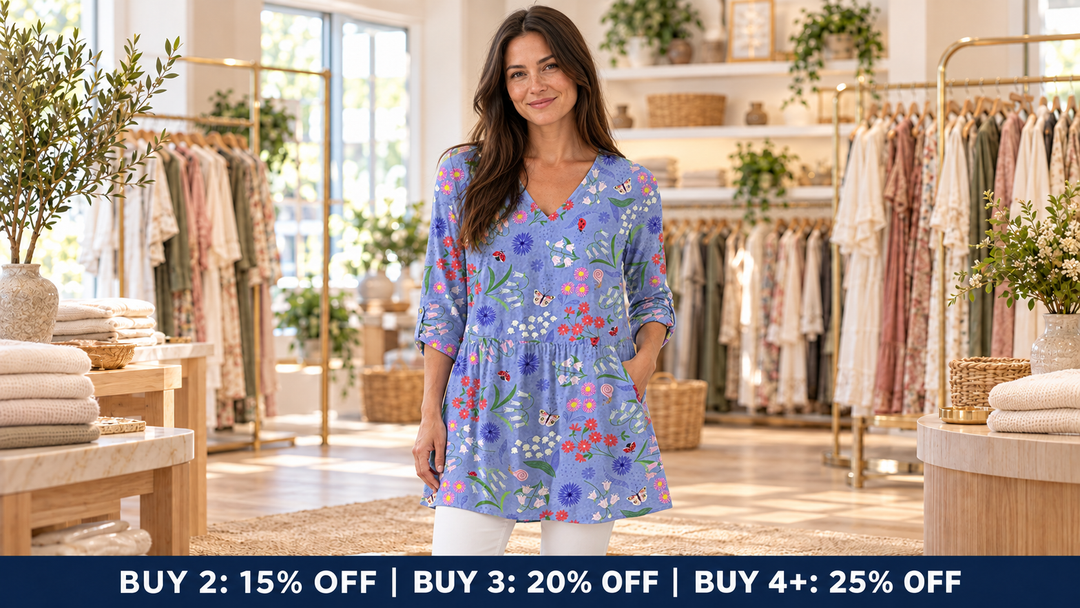 Model in her late thirties wearing the blue floral Aline long blouse in the Jane & Grace boutique