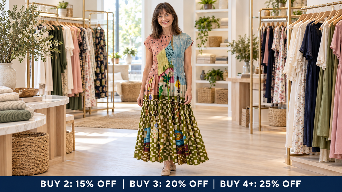Mature model wearing a printed pleated retro maxi dress in the Jane & Grace boutique