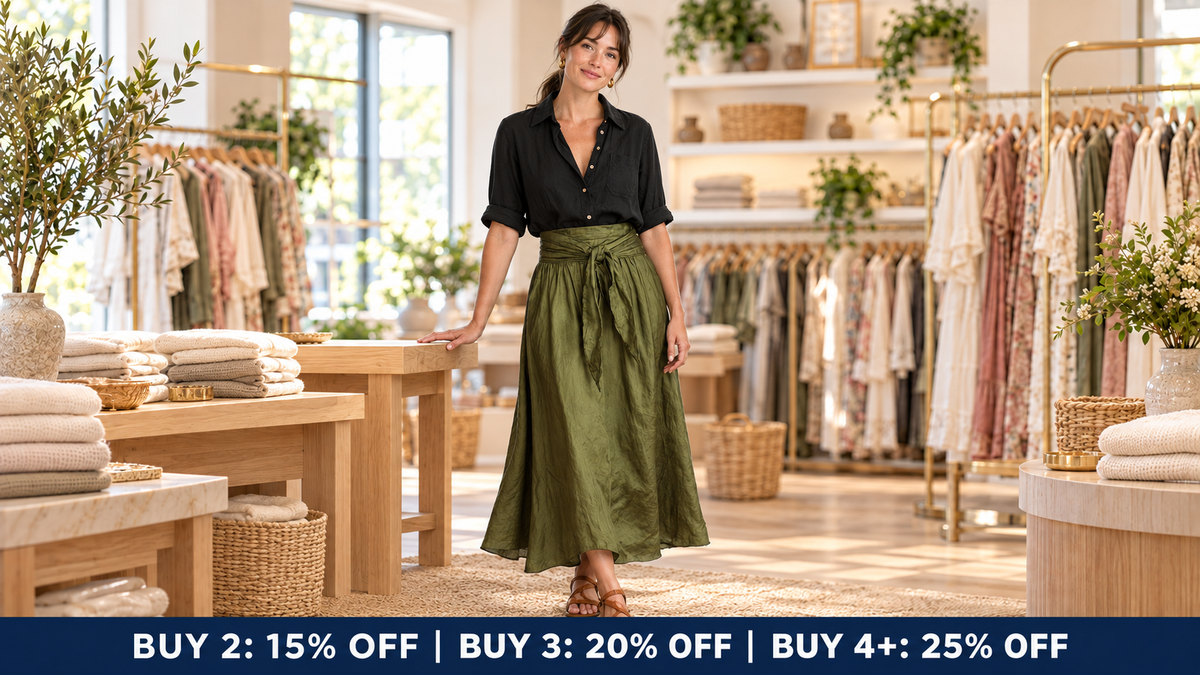 Model in her late thirties wearing the black and olive River set inside the Jane & Grace boutique